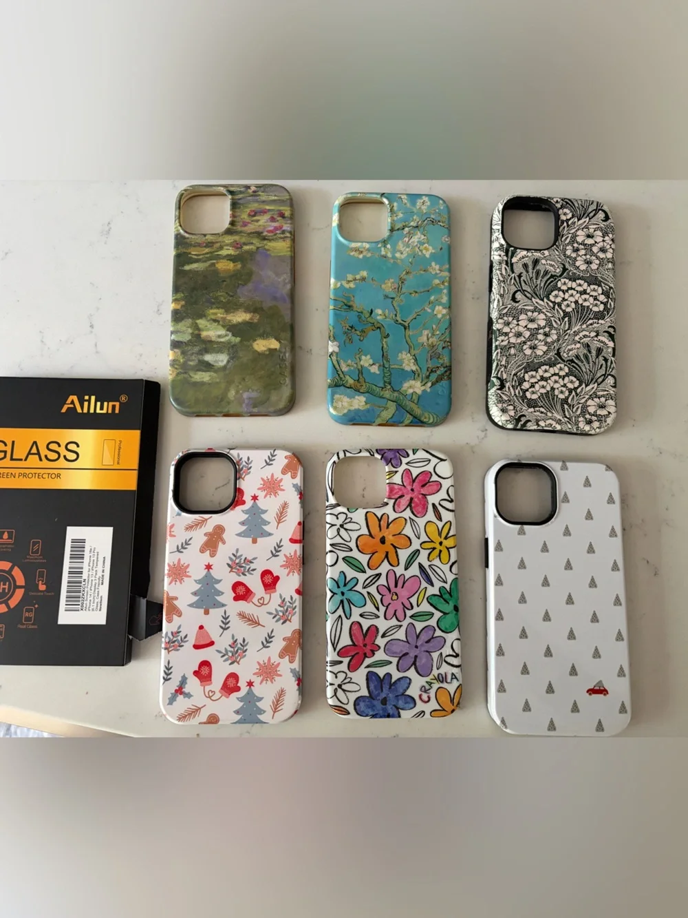 6 Casely Iphone13 pro cases in different designs and two AlilunScreen Protectors